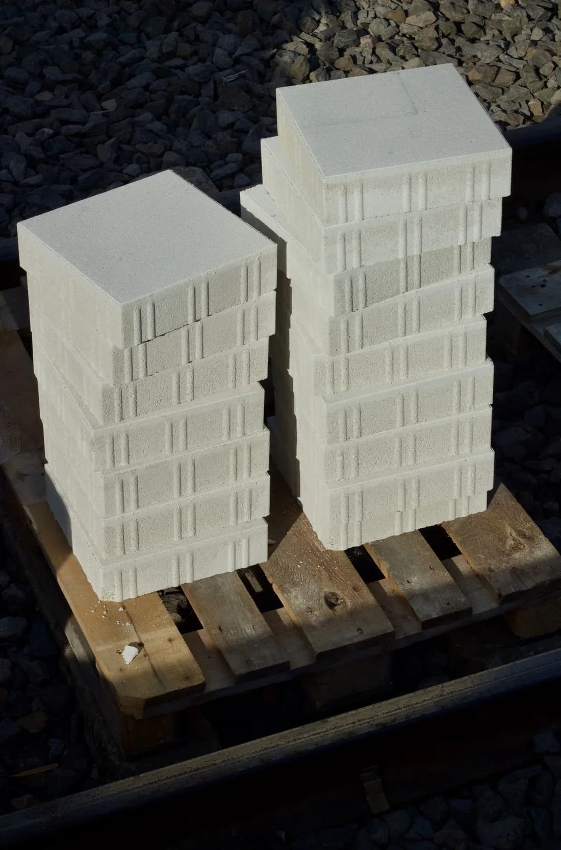 Pale concrete masonry blocks neatly stacked in a full pallet load