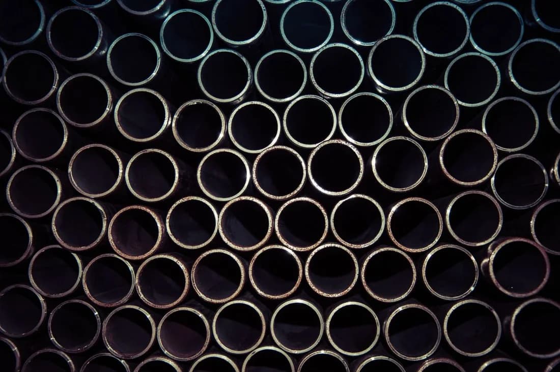 Round metal tube ends neatly stacked in a close-up material reference photograph